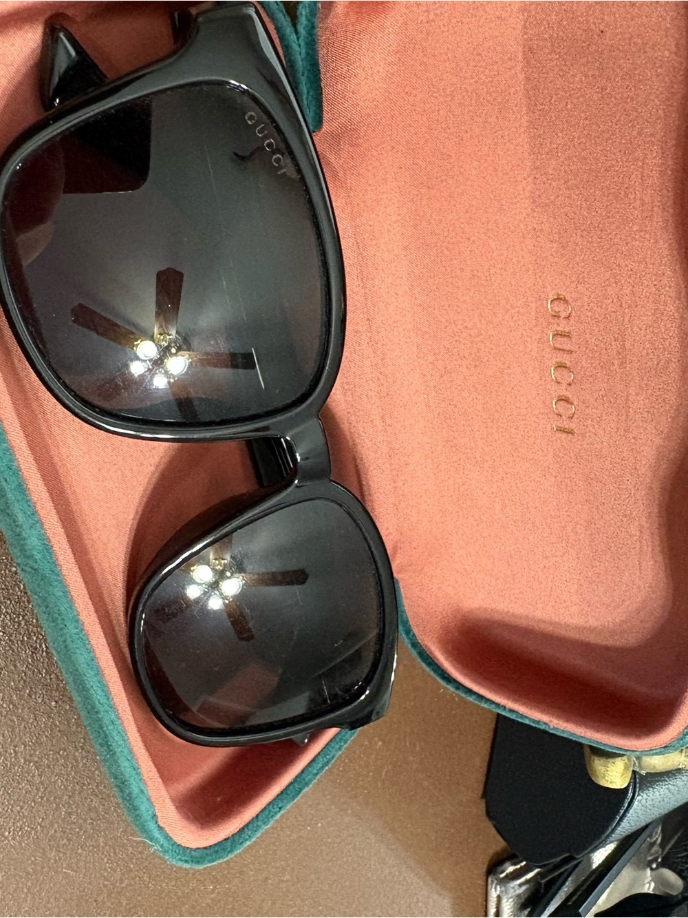 Gucci Black Frame Sunglasses with Dark Lenses
